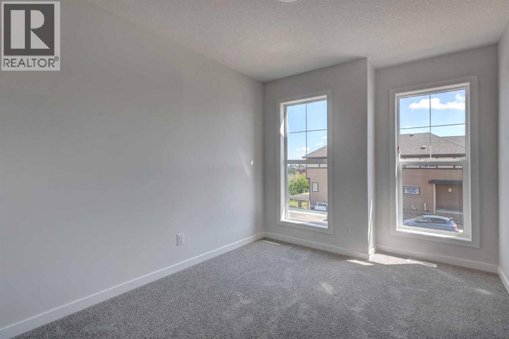Photo 11 of 98 Silver Spruce Road Sw, Calgary AB