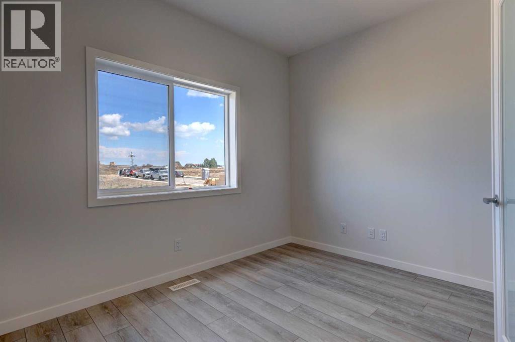 Photo 2 of 98 Silver Spruce Road Sw, Calgary AB