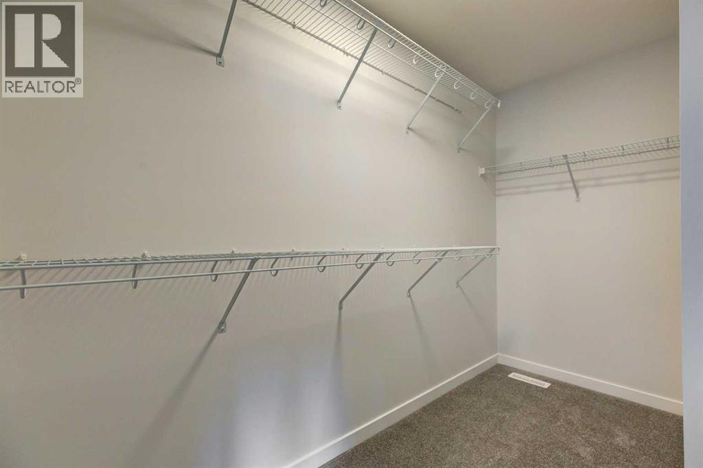 Photo 19 of 98 Silver Spruce Road Sw, Calgary AB