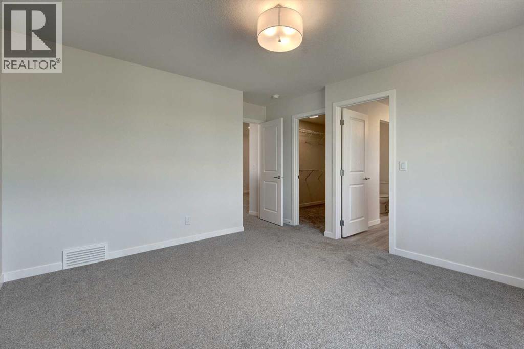 Photo 1 of 98 Silver Spruce Road Sw, Calgary AB