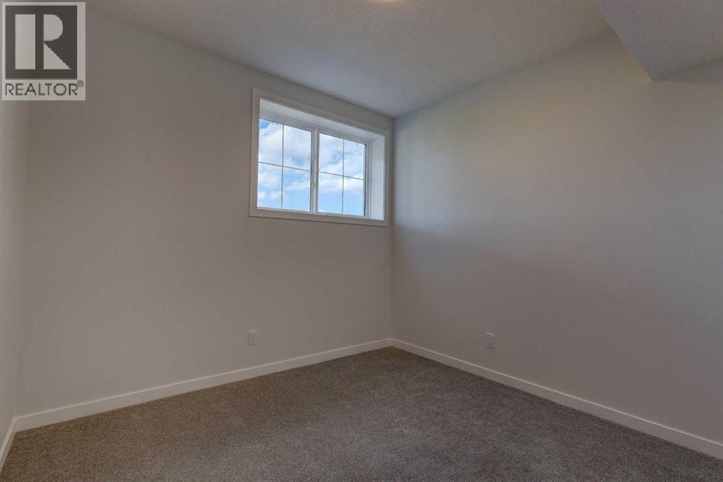 Photo 32 of 98 Silver Spruce Road Sw, Calgary AB
