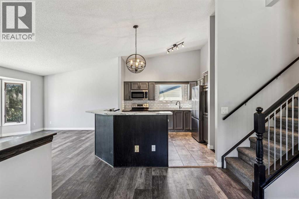 Single Family House 4 Level for Sale in  Hawkley Valley Road NW Hawkwood Calgary 