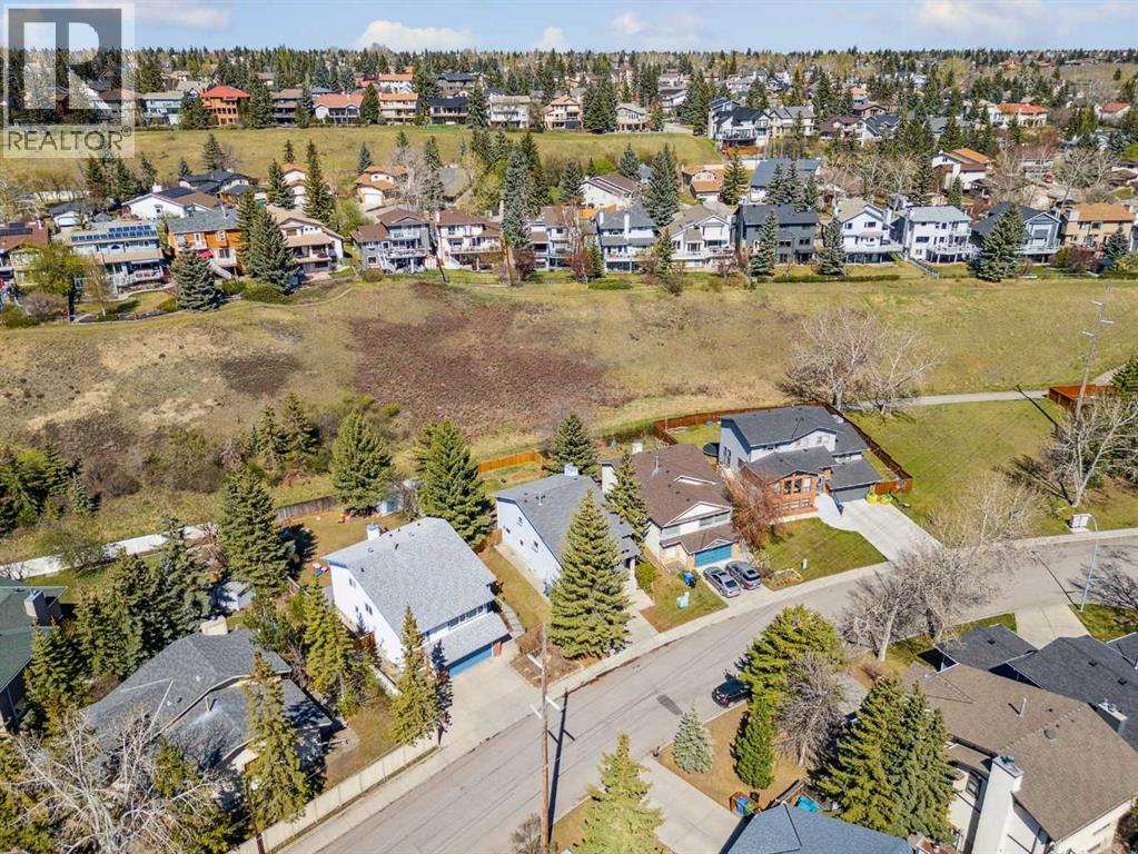 Single Family House 4 Level for Sale in  Hawkley Valley Road NW Hawkwood Calgary 