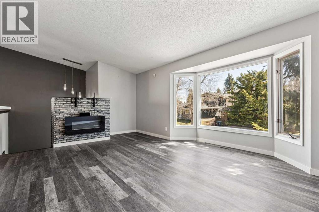 Single Family House 4 Level for Sale in  Hawkley Valley Road NW Hawkwood Calgary 