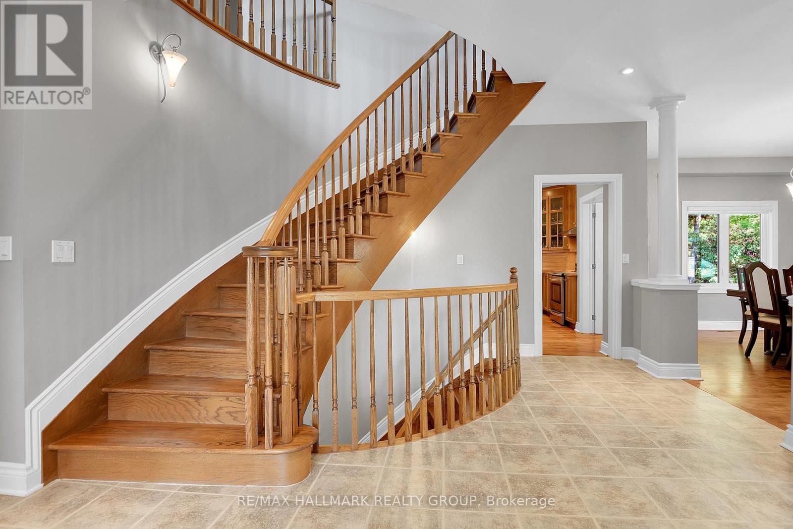 FOYER | impressive oak curved stairway up and down