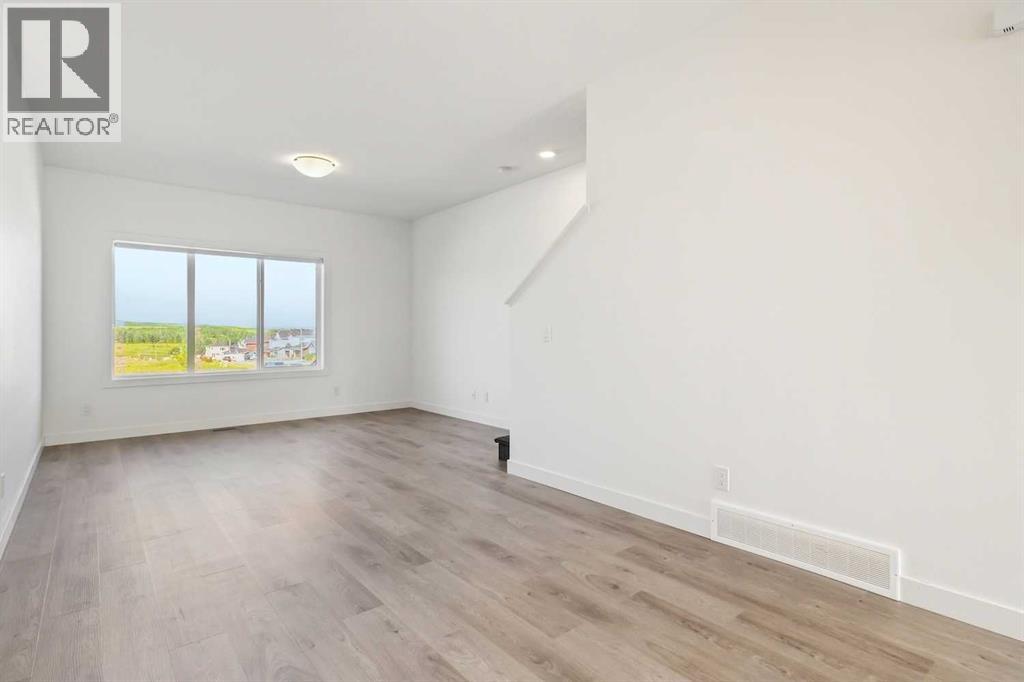 Photo 4 of 203 24 Rivercrest Drive, Cochrane AB
