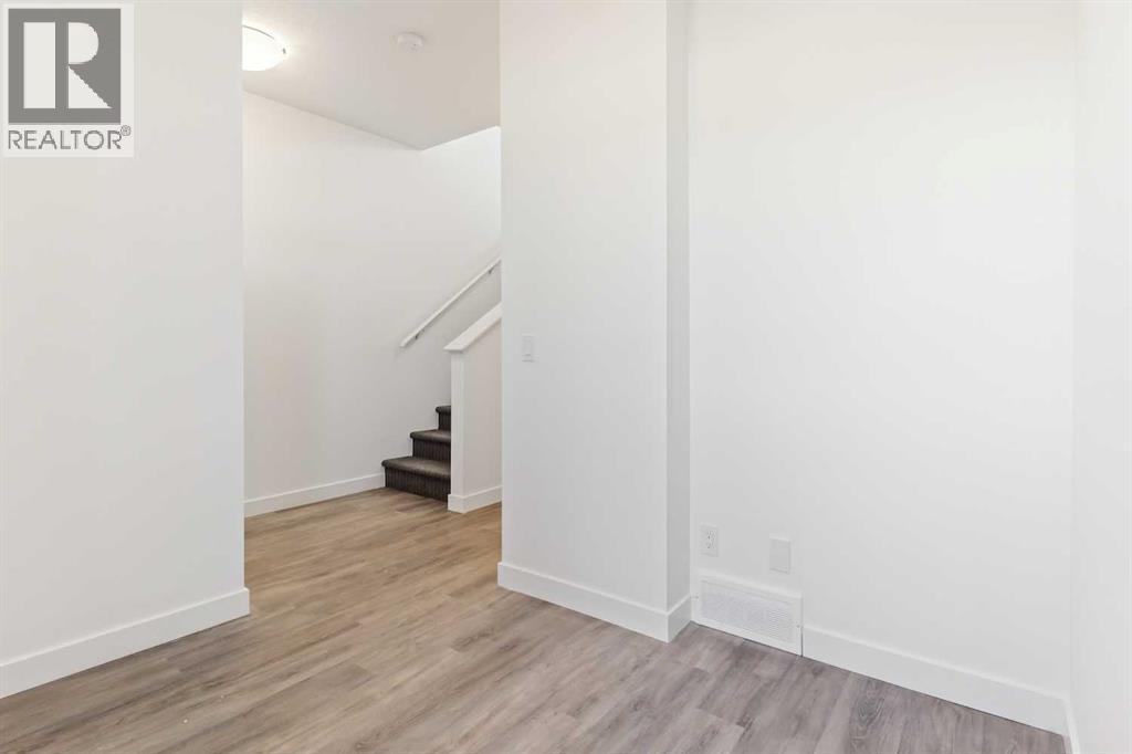 Photo 17 of 203 24 Rivercrest Drive, Cochrane AB