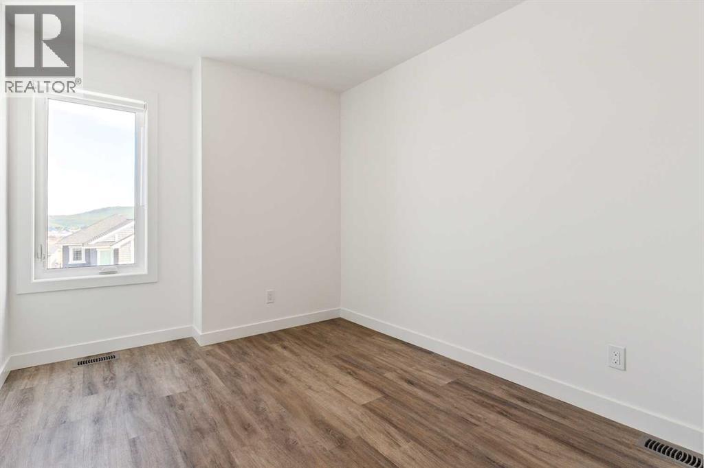 Photo 10 of 703 24 Rivercrest Drive, Cochrane AB