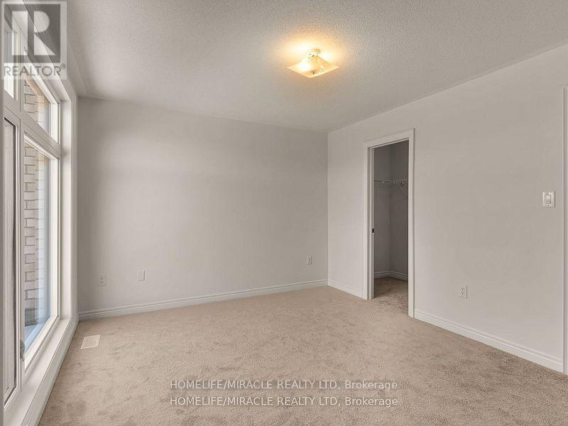 Photo 7 of 18 Queenpost Drive, Brampton ON
