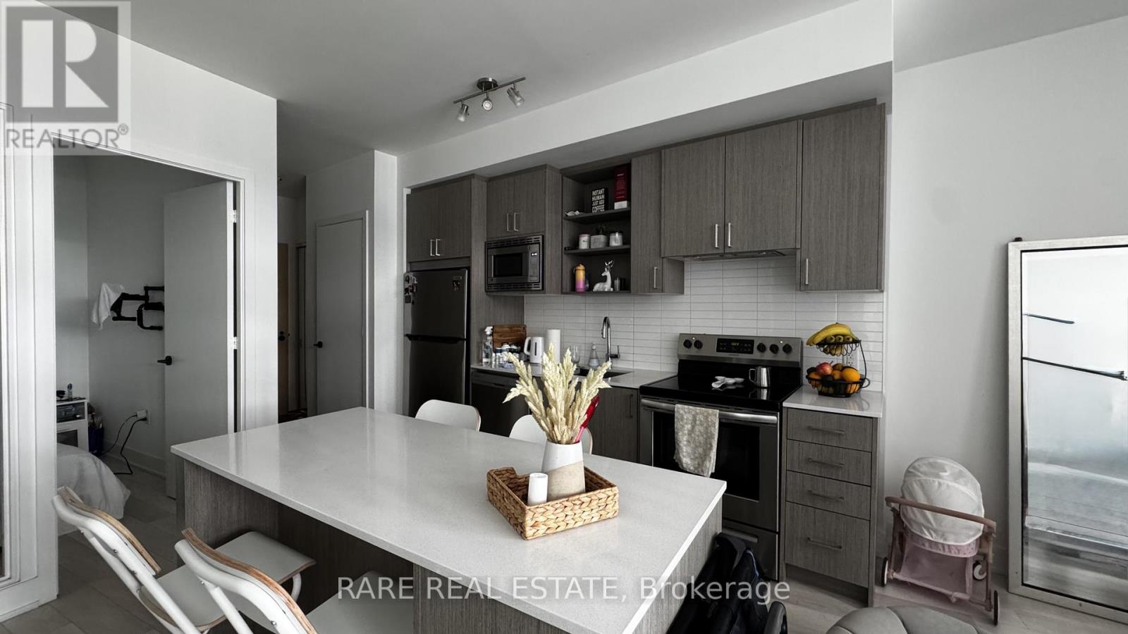Photo 8 of 208 60 George Butchart Drive, Toronto ON
