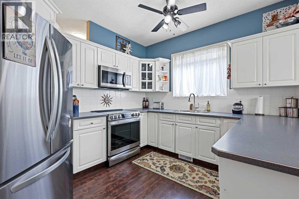 Single Family House Bungalow for Sale in  Signal Hill Lane SW Signal Hill Calgary 
