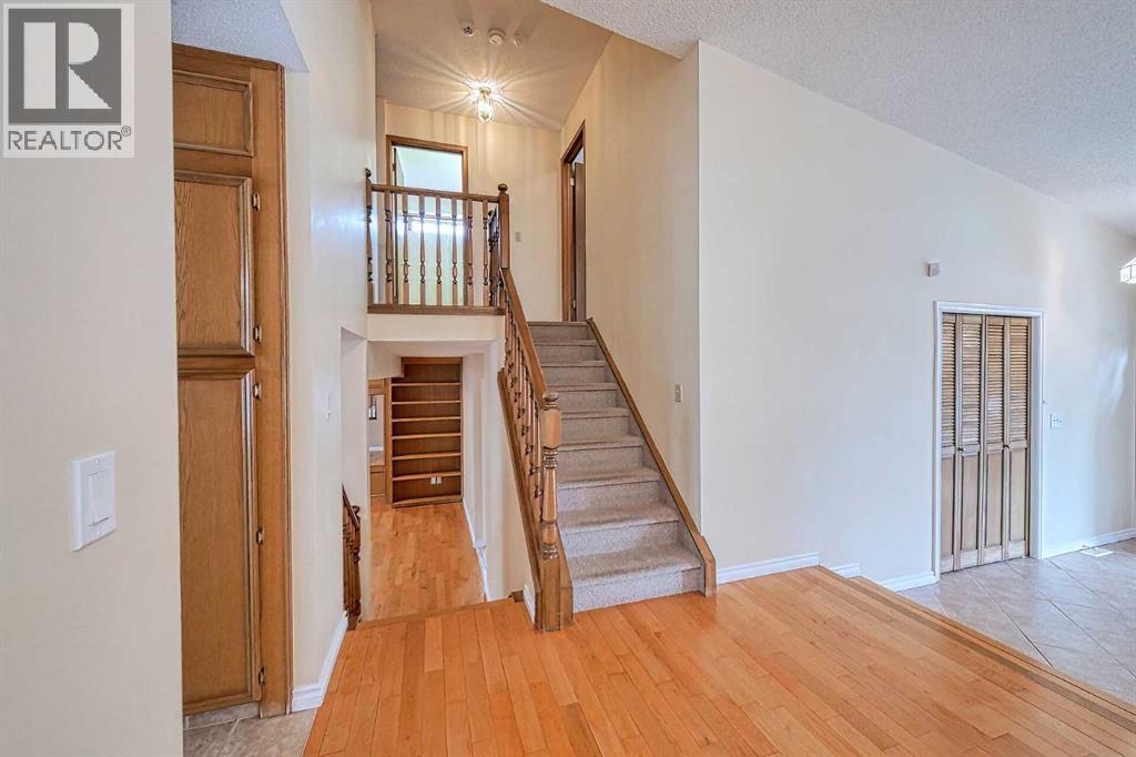 Single Family House 4 Level for Sale in  Hawkhill Place NW Hawkwood Calgary 