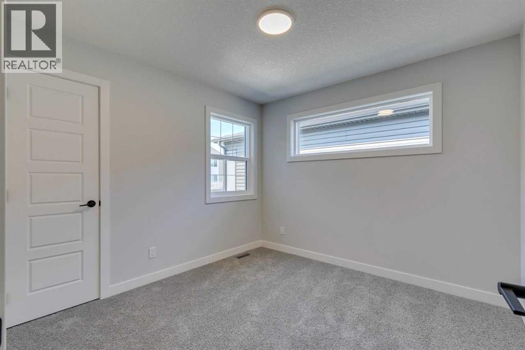 Photo 30 of 126 Belmont Passage Sw, Calgary AB