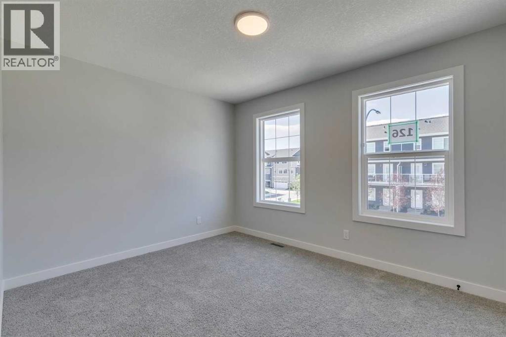 Photo 32 of 126 Belmont Passage Sw, Calgary AB