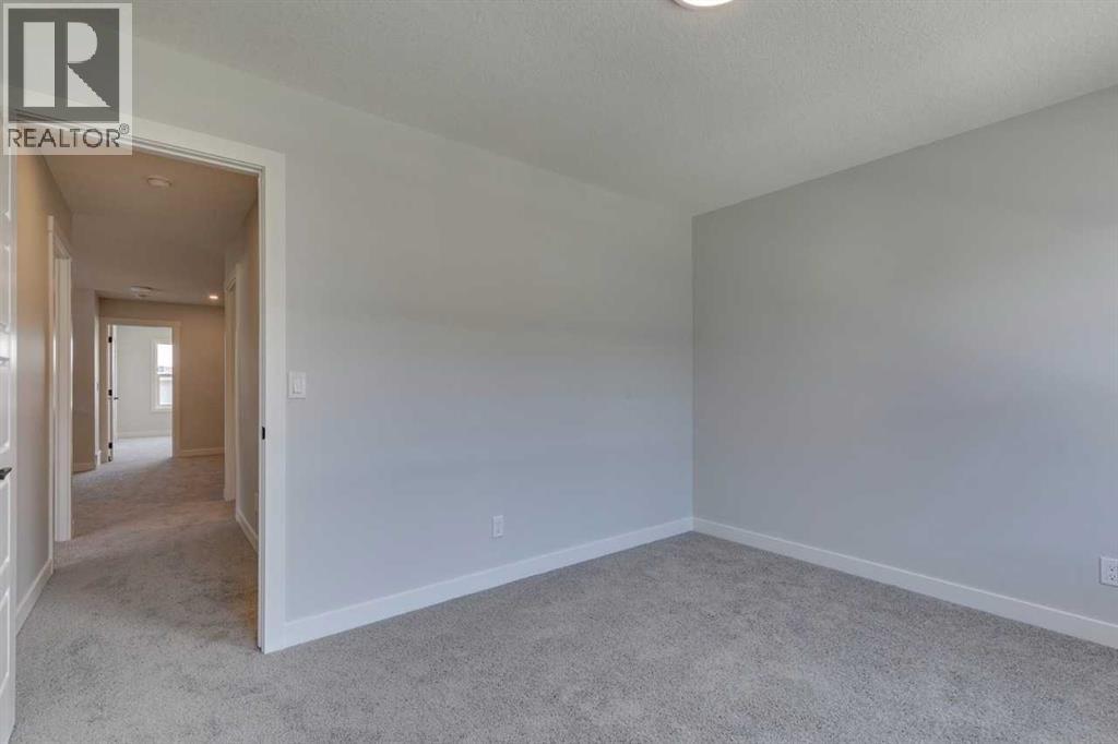Photo 33 of 126 Belmont Passage Sw, Calgary AB