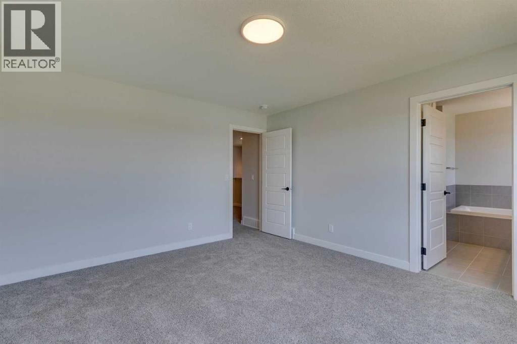 Photo 36 of 126 Belmont Passage Sw, Calgary AB