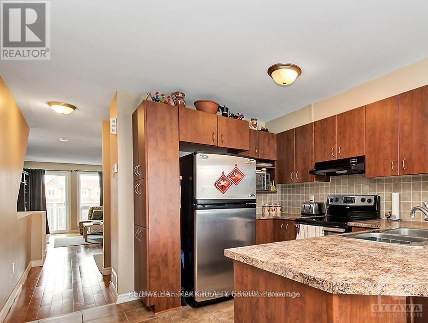 Kitchen with stainless steel appliances.