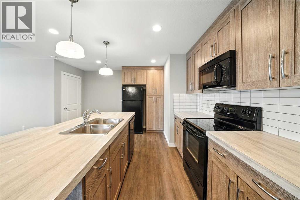 Photo 21 of 100 44 Reid Court, Sylvan Lake AB