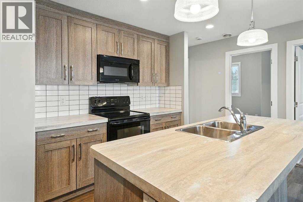 Photo 12 of 100 44 Reid Court, Sylvan Lake AB