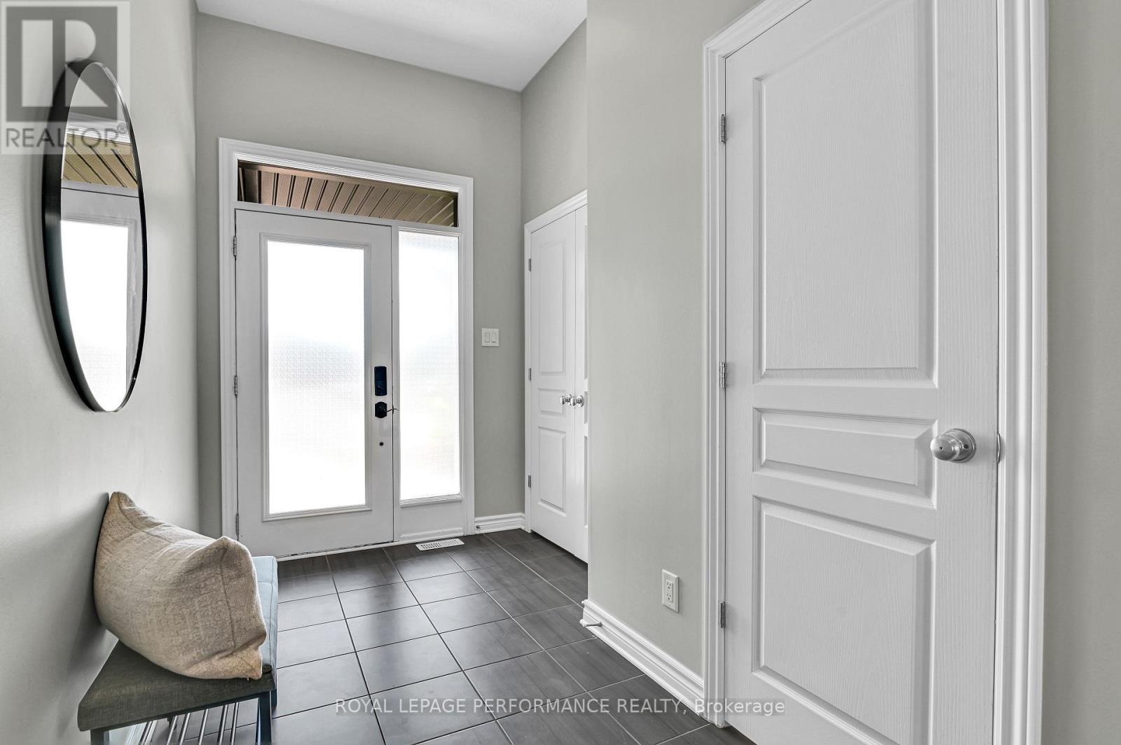 Modern bright Foyer with easy care tile flooring