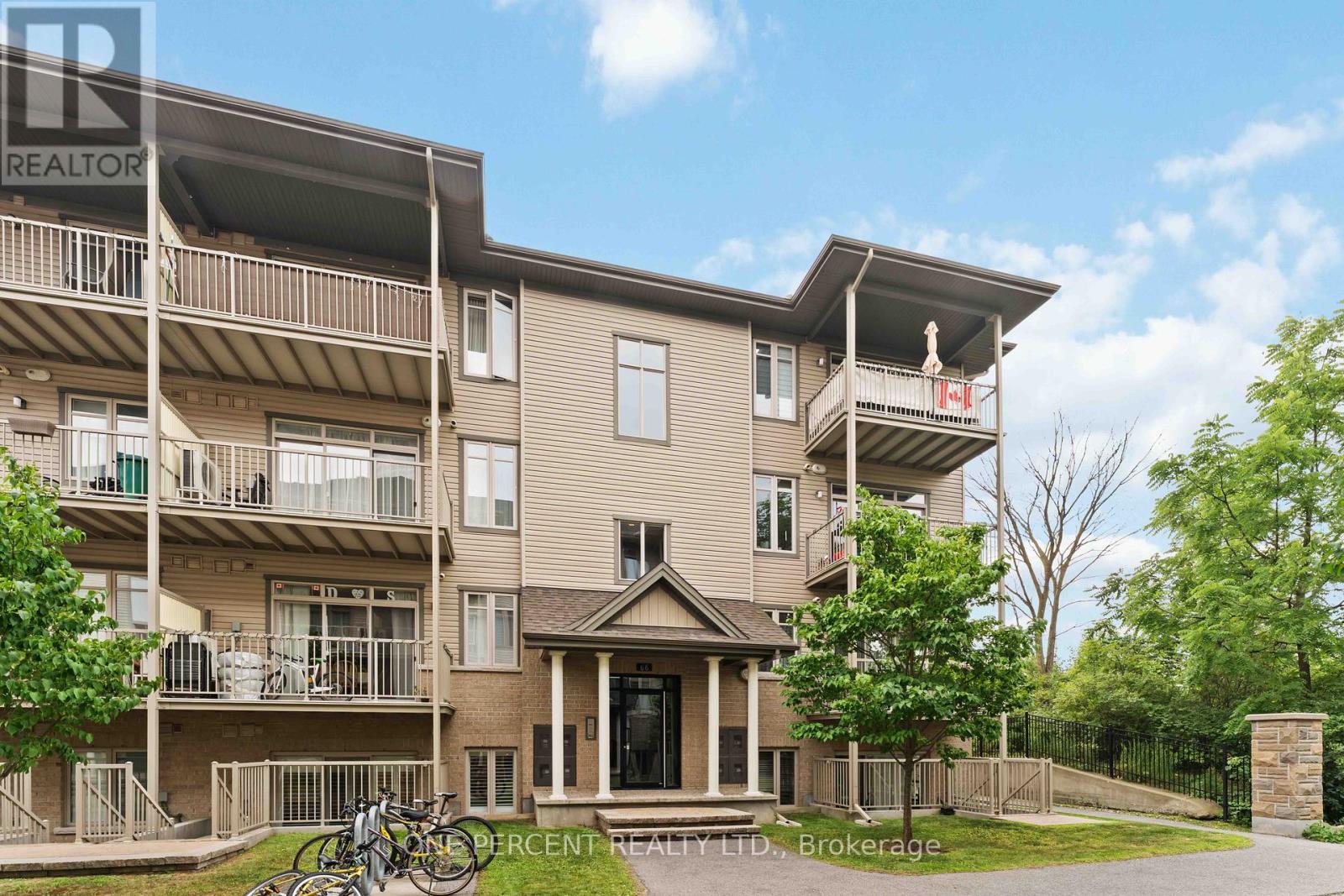 Back of building with image of balcony to the unit