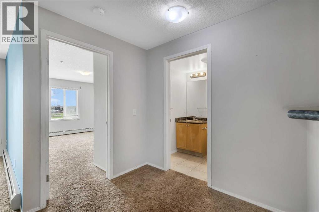 Photo 5 of 6307 304 Mackenzie Way Sw, Airdrie AB