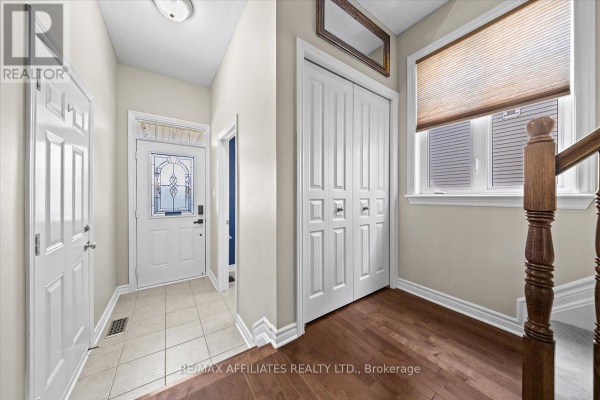 Open foyer with garage access & powder room
