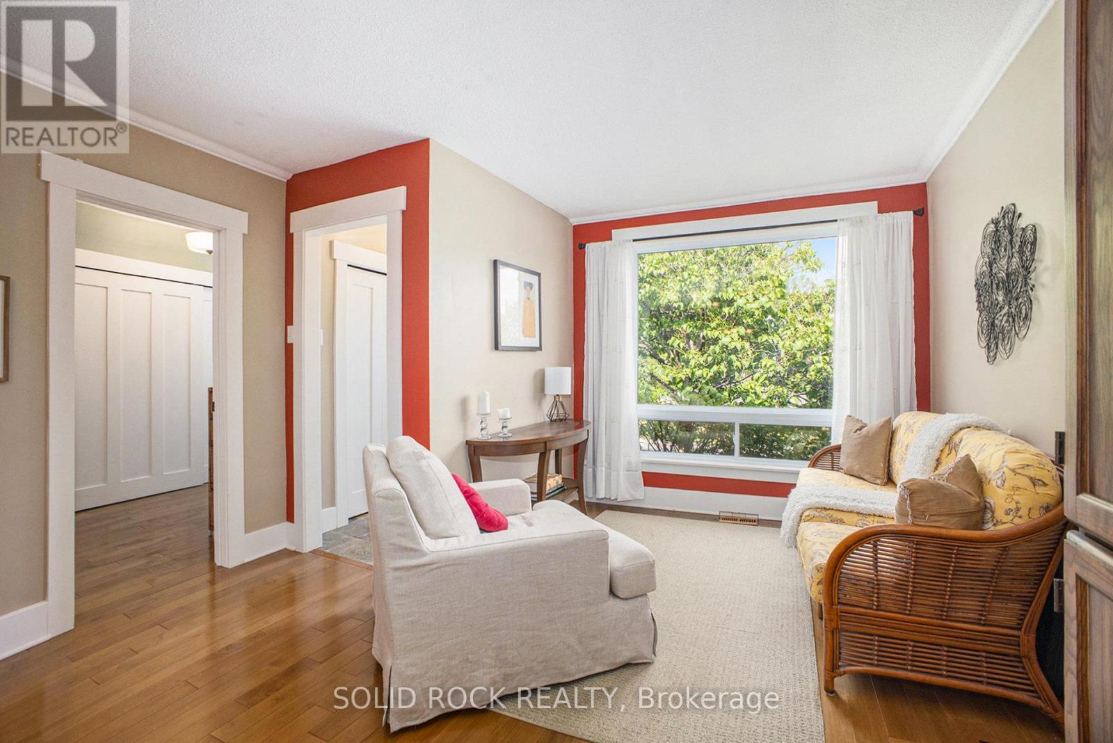 Living room leading to primary bedrooom