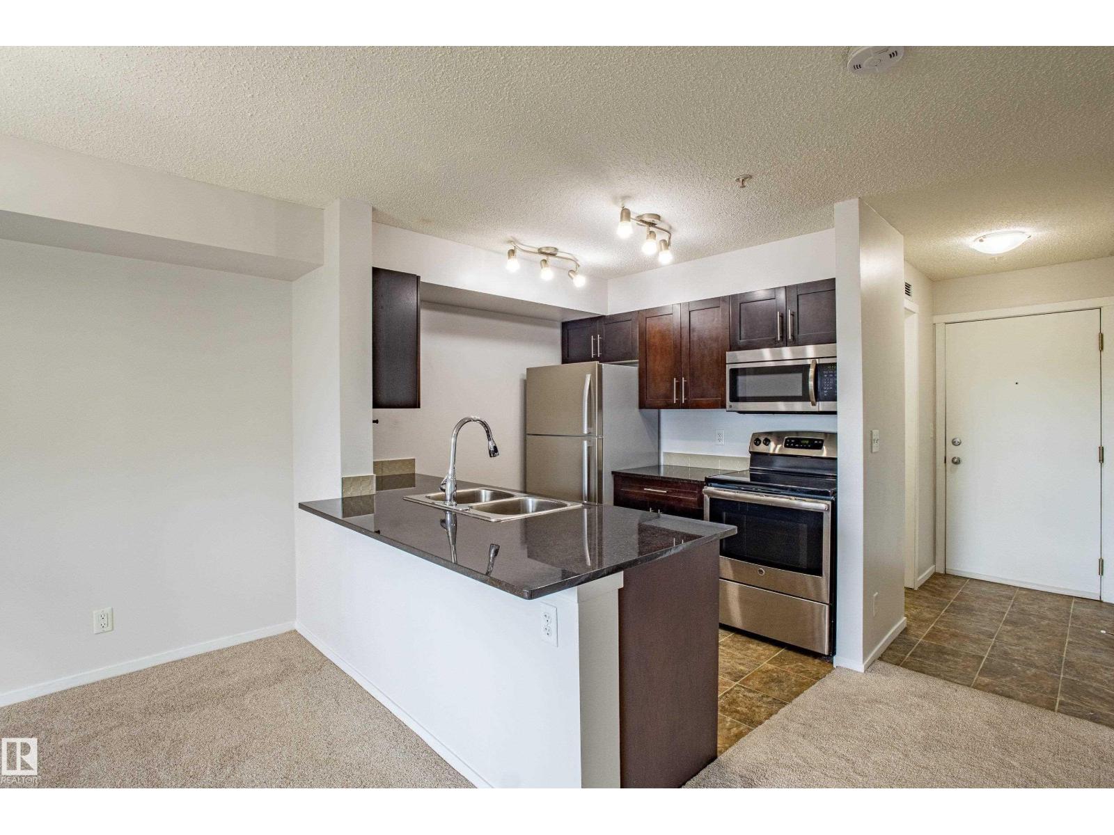 Photo 7 of 108 5810 Mullen Pl Nw, Edmonton AB