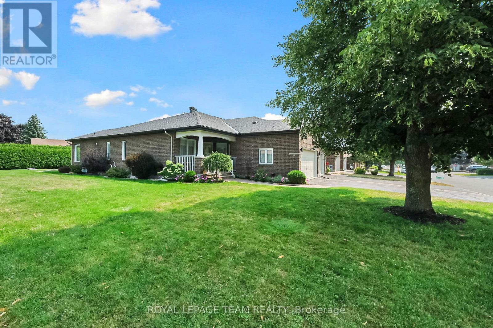 Attached dbl Garage w/covered porch entry