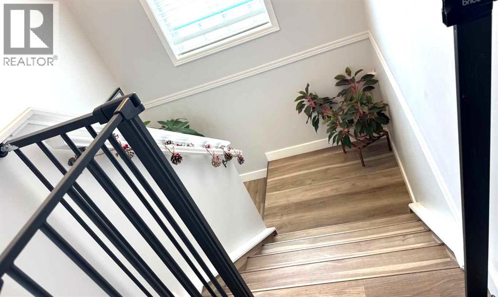 Photo 10 of 8 304 Ross Avenue, Cochrane AB