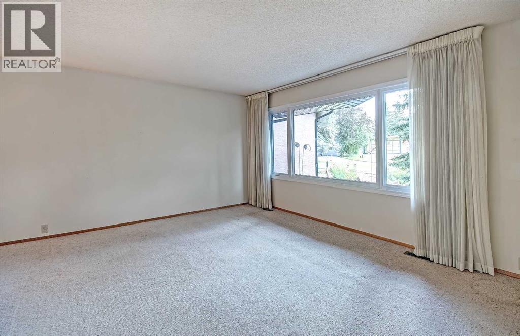Single Family House 4 Level for Sale in  Lake Acadia Place SE Lake Bonavista Calgary 