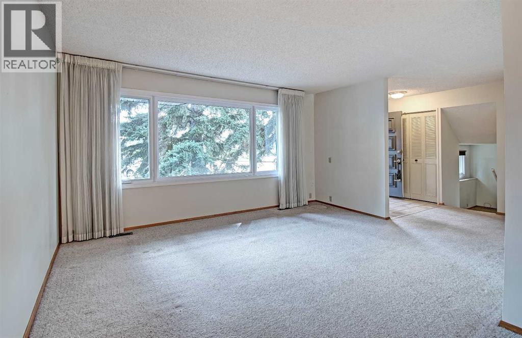 Single Family House 4 Level for Sale in  Lake Acadia Place SE Lake Bonavista Calgary 