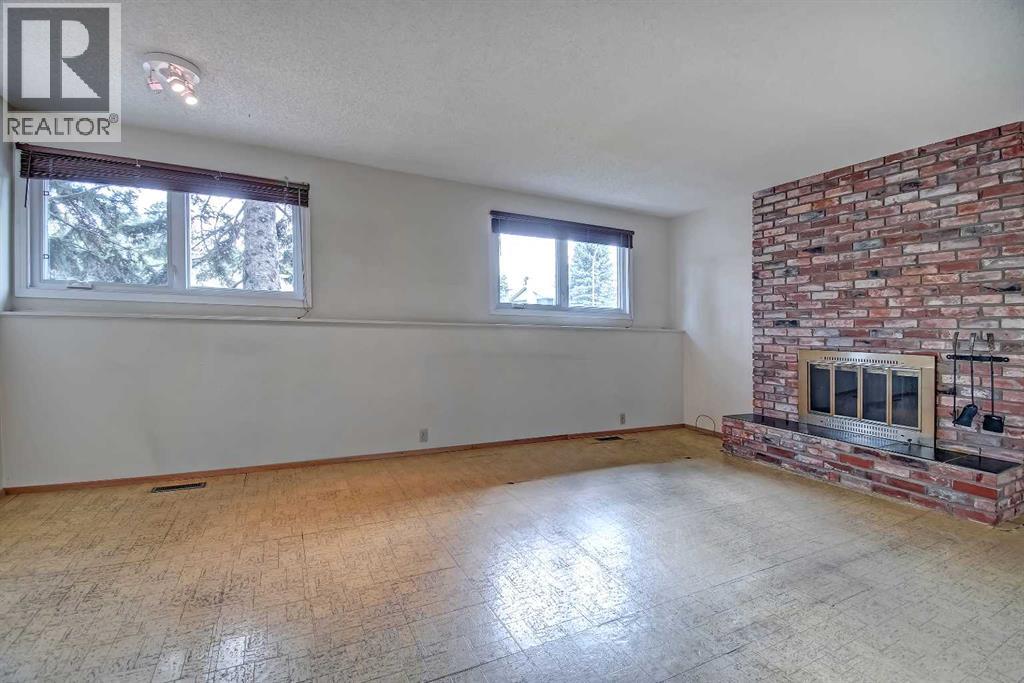 Single Family House 4 Level for Sale in  Lake Acadia Place SE Lake Bonavista Calgary 