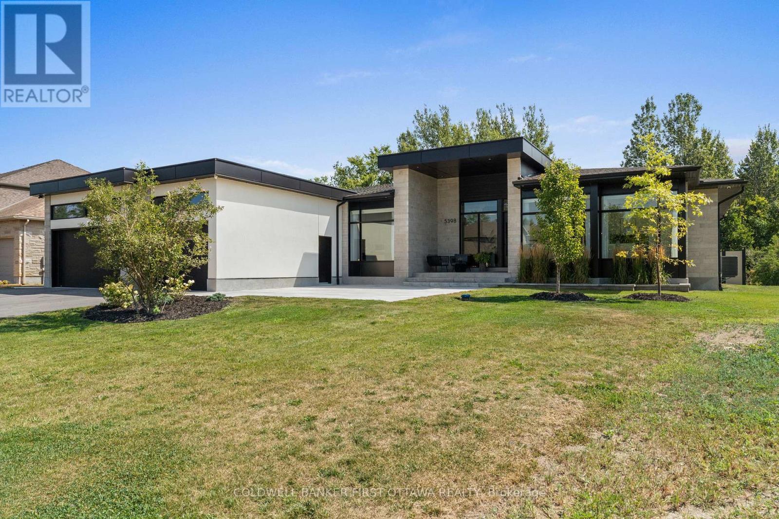 Expansive private lot & hardscaped backyard.