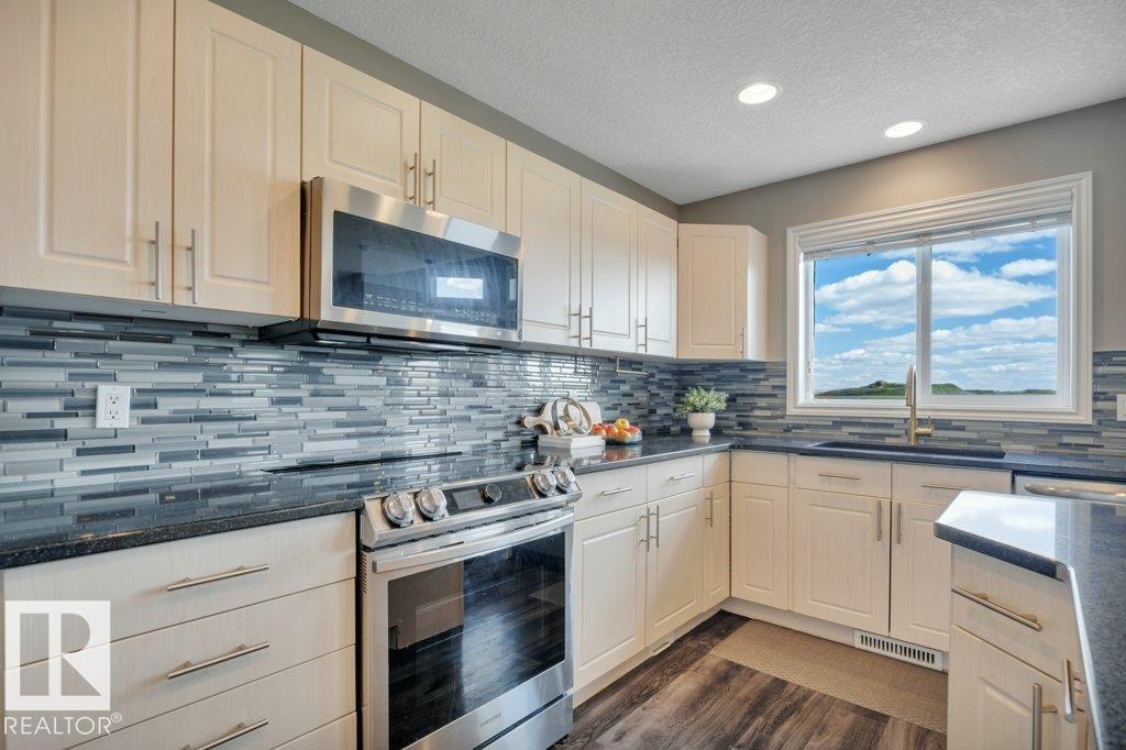 Photo 59 of 53 Douglas Cr, Leduc AB