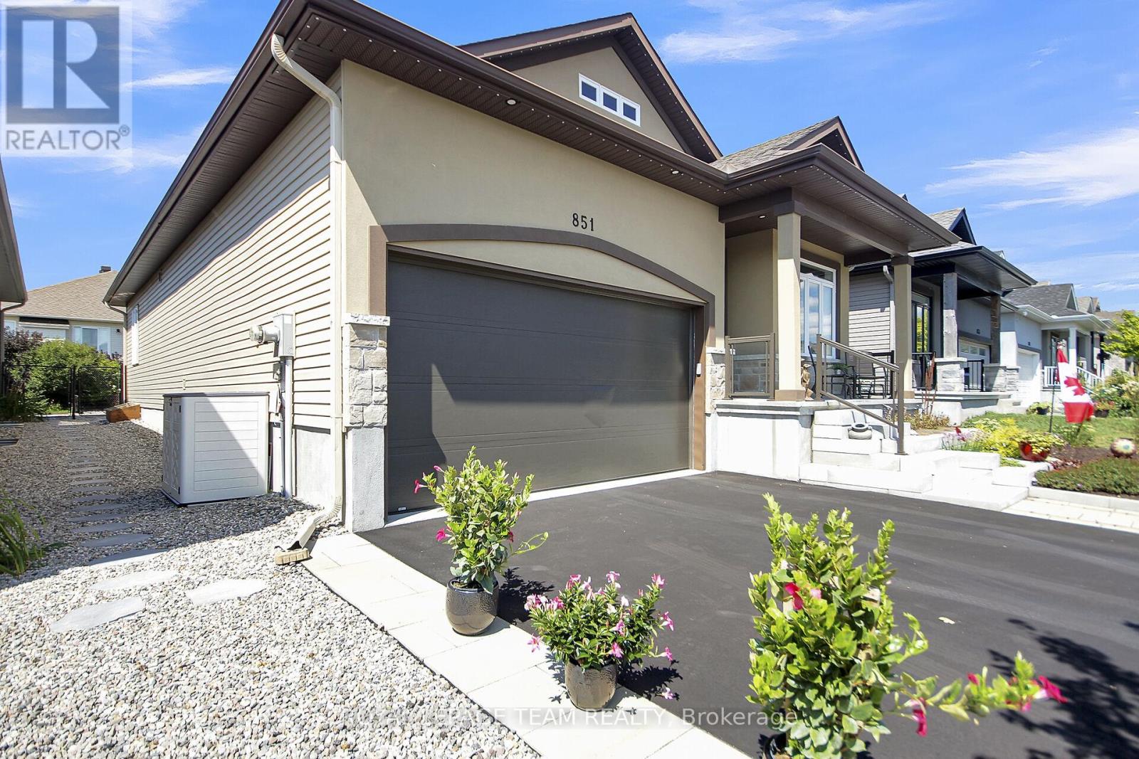 2 car garage, paved driveway.