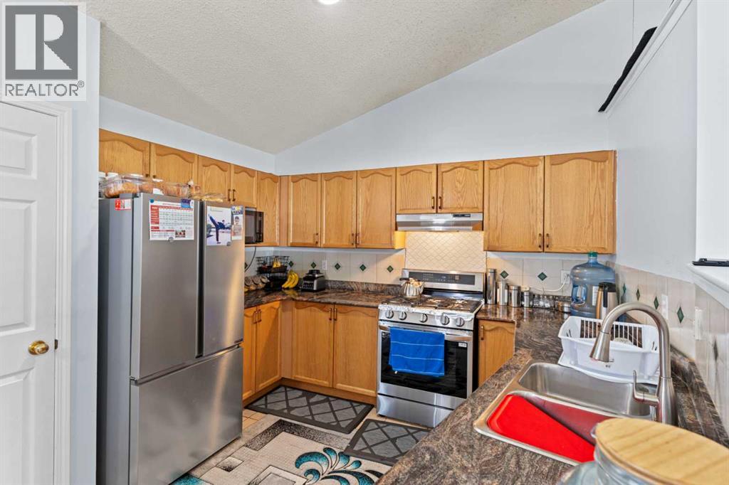 Single Family House 4 Level for Sale in  Laguna Way NE Monterey Park Calgary 