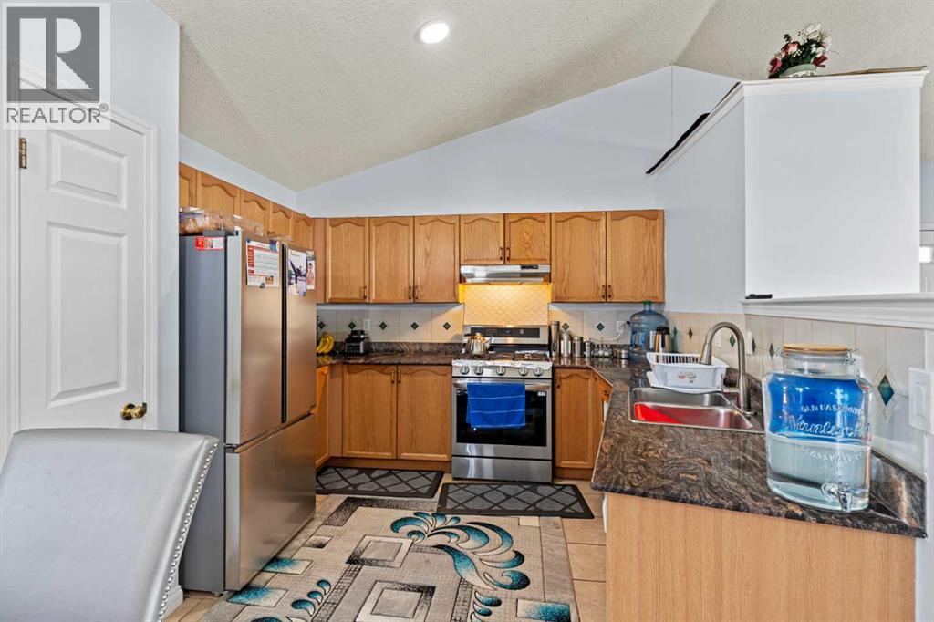 Single Family House 4 Level for Sale in  Laguna Way NE Monterey Park Calgary 