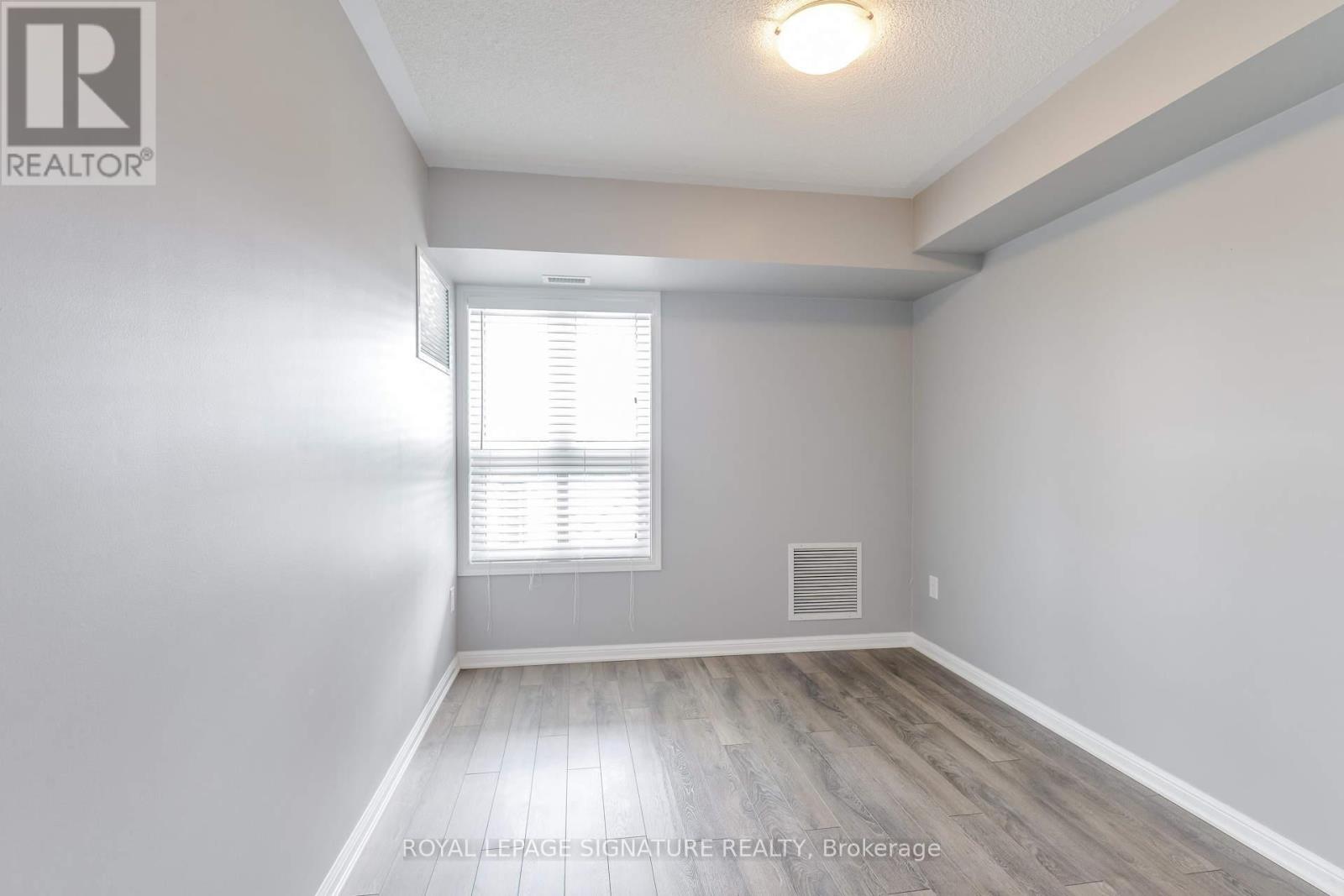 Photo 13 of 408 1045 Nadalin Heights, Milton ON