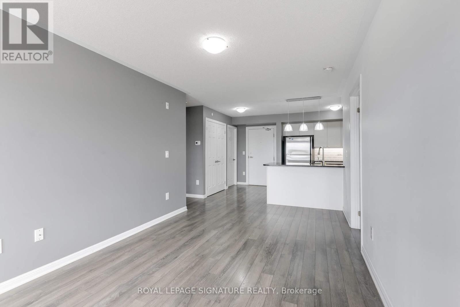 Photo 4 of 408 1045 Nadalin Heights, Milton ON