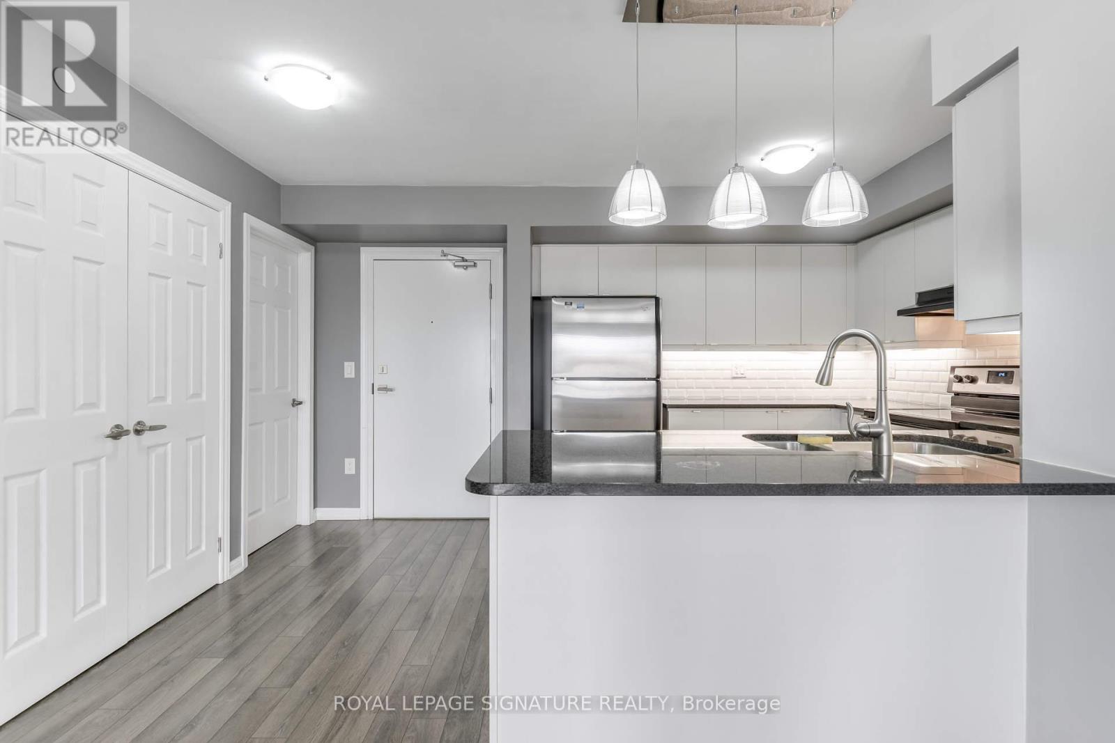 Photo 5 of 408 1045 Nadalin Heights, Milton ON
