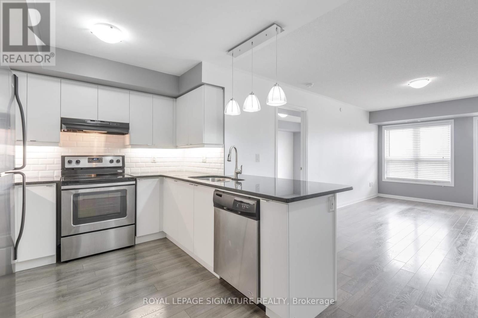 Photo 8 of 408 1045 Nadalin Heights, Milton ON