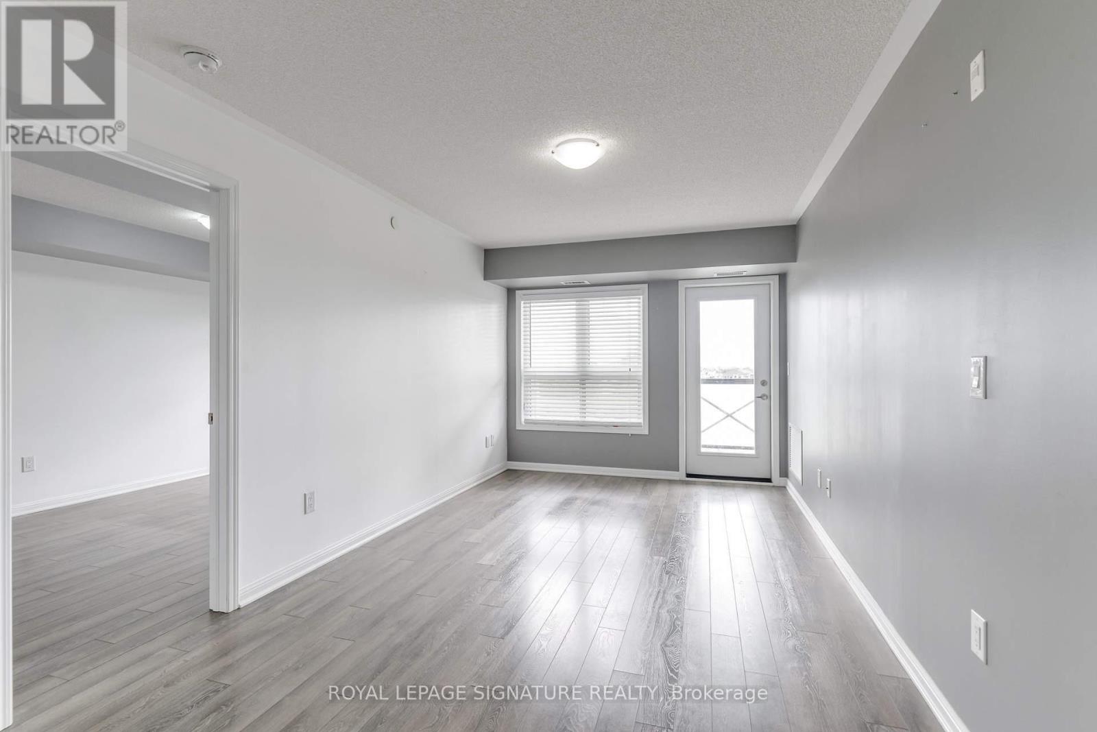 Photo 9 of 408 1045 Nadalin Heights, Milton ON