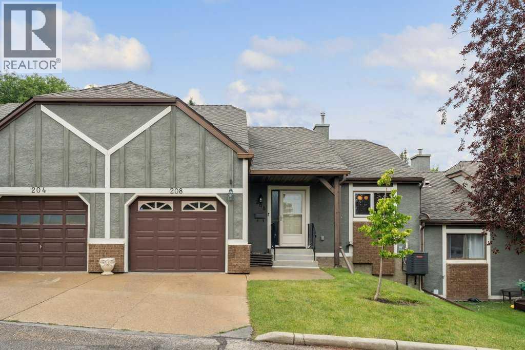 Photo 3 of 208 Coach Side Road Sw, Calgary AB