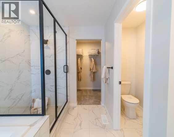 Single Family House for Sale in  Lucas Gardens NW Livingston Calgary 