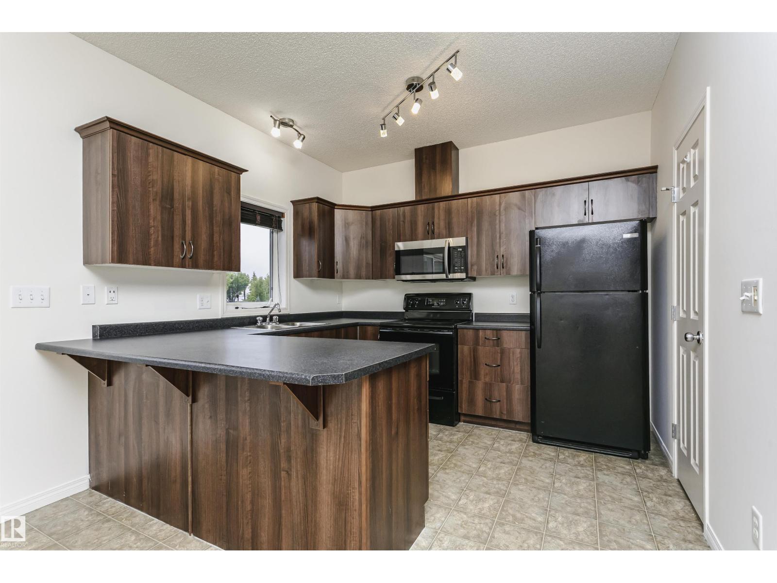 Photo 23 of 50 5102 30 Av, Beaumont AB