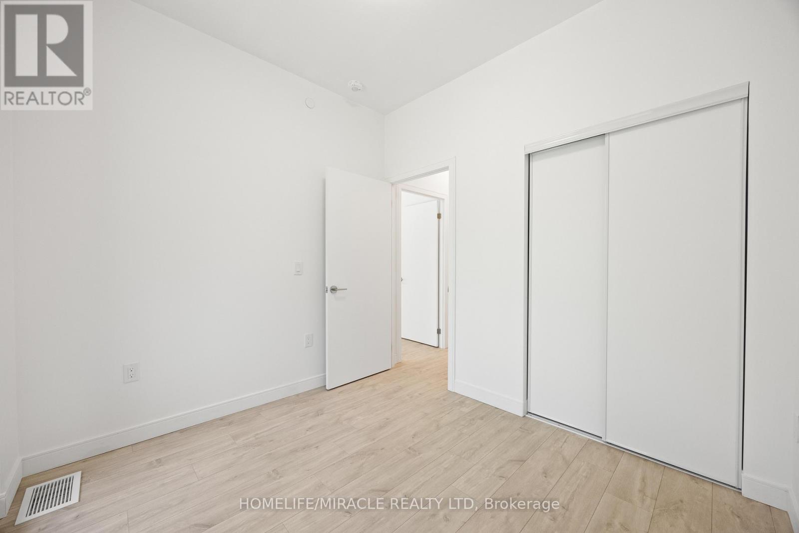 Photo 6 of 9 174 Clonmore Drive, Toronto ON