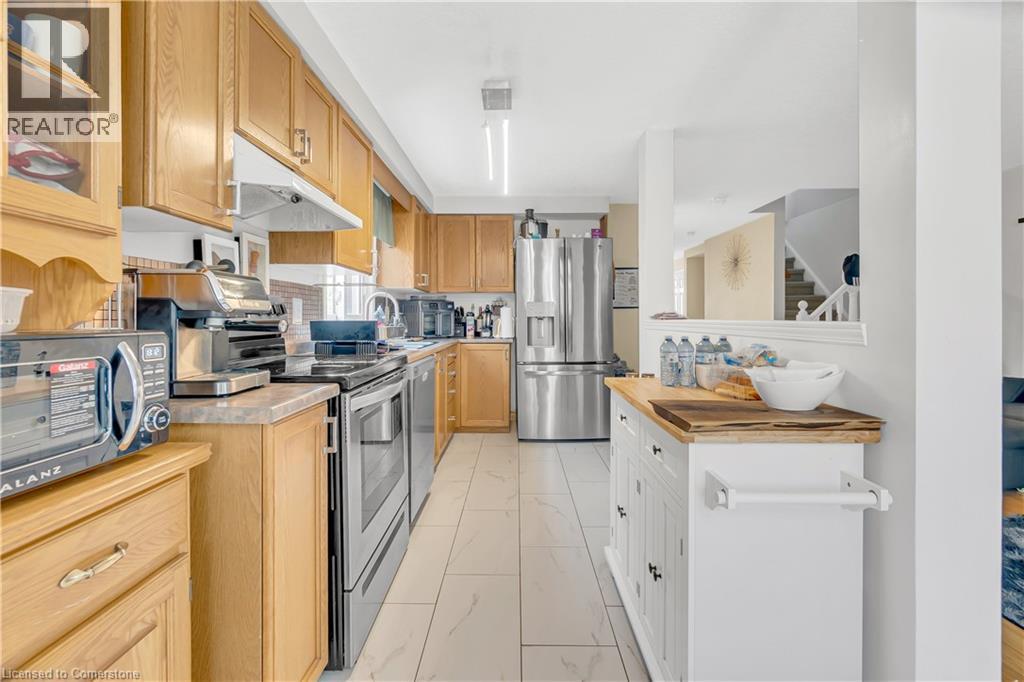 Photo 11 of 174 Wilderness Drive, Kitchener ON