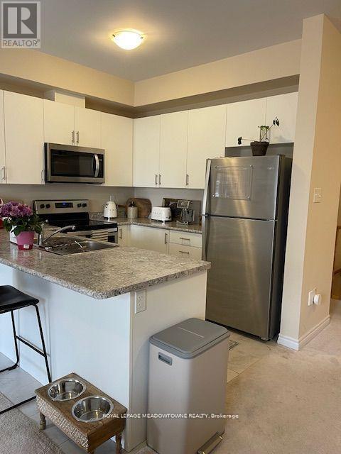 Photo 2 of 28 88 Decorso Drive, Guelph ON